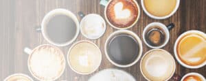 assorted coffee cups on a wooden table